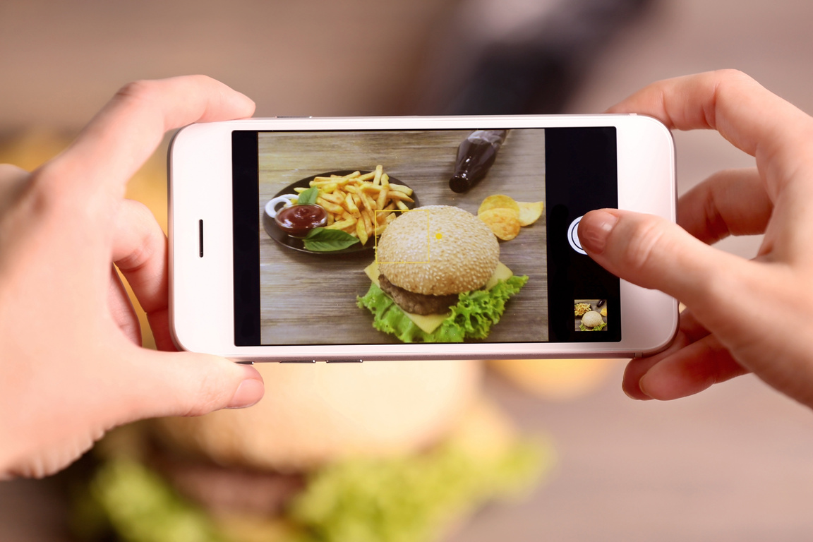 Woman Taking Photo of Hamburgers on Smartphone